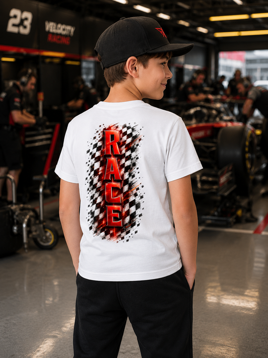 Child wearing a white t-shirt with 'RACE' design in a garage setting