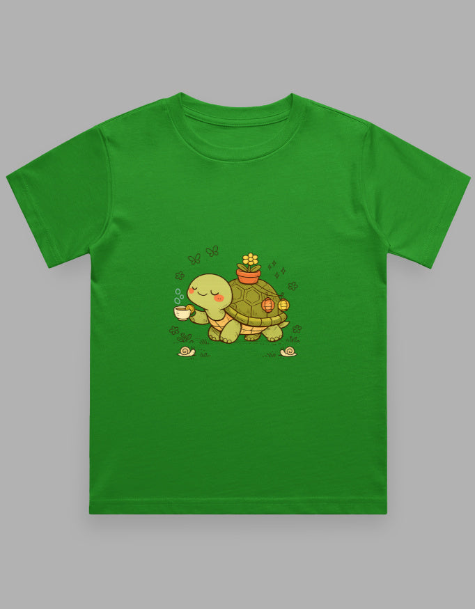 Green t-shirt with a cartoon turtle design on a gray background